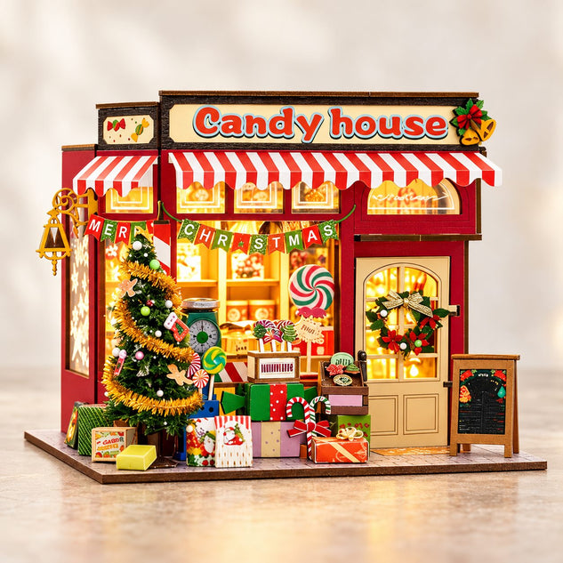 DIY Christmas candy house miniature model with warm lights - front hero view
