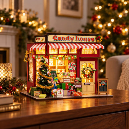 Illuminated Christmas candy house miniature in a festive home setting