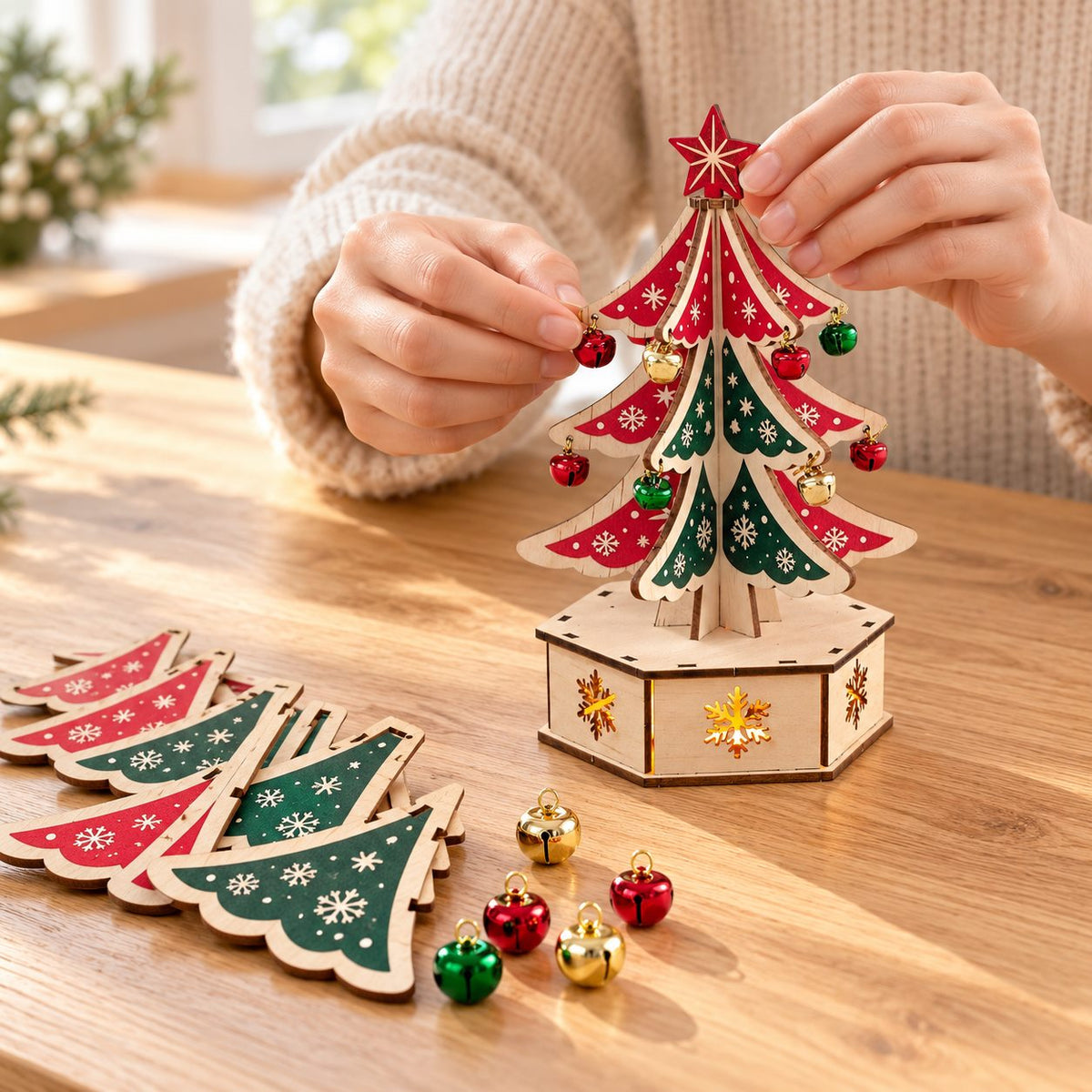 Adult hands assembling the wooden Christmas tree decoration