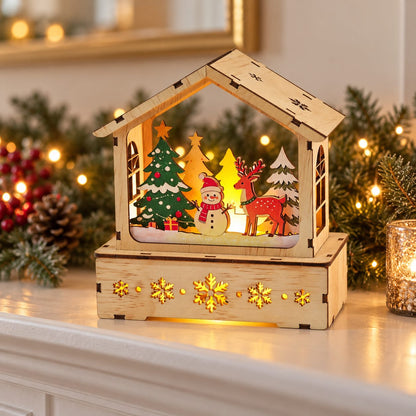Wooden Christmas winter scene house displayed on a festive mantel
